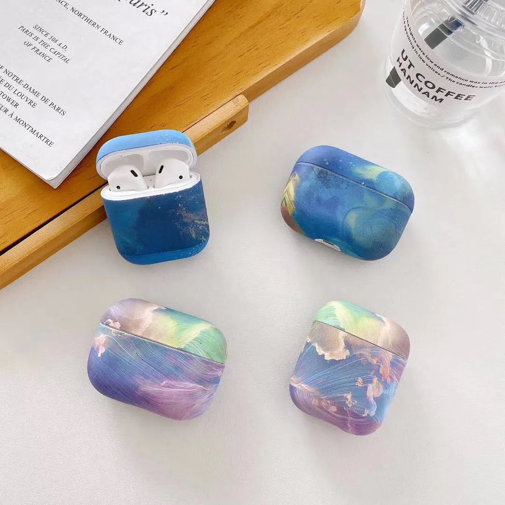 Hard plastic protective sleeve for Apple AirPods with watercolour design in pink or blue options