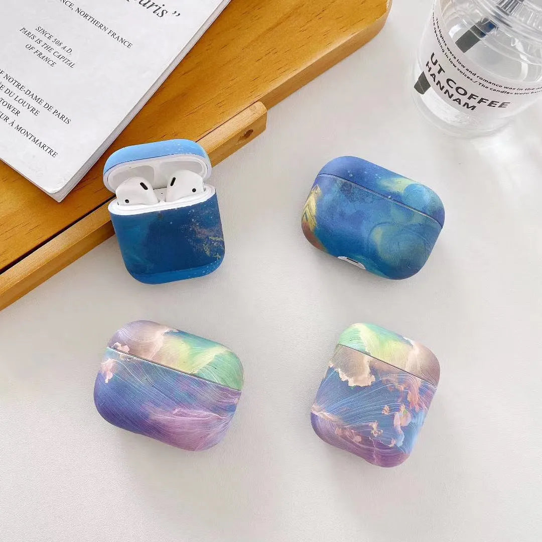 Hard plastic protective sleeve for Apple AirPods with watercolour design in pink or blue options