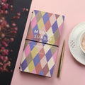 Simple soft cover TN hand book diary notebook open on a table.