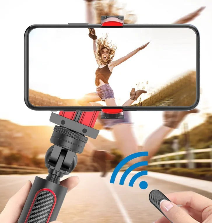 Black aluminium video balance stabiliser tripod extended with a smartphone secured in the adjustable clamp.