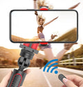 Black aluminium video balance stabiliser tripod extended with a smartphone secured in the adjustable clamp.