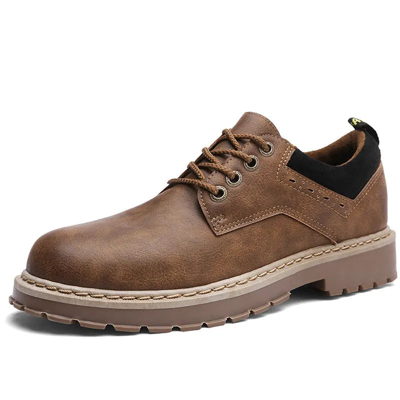 Men's black casual shoes with round toe and front laces on a plain background