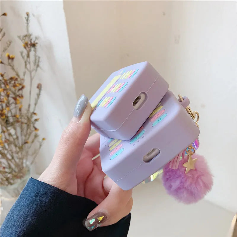 Purple silicone protective case for Apple AirPods with detachable fur ball pendant accessory