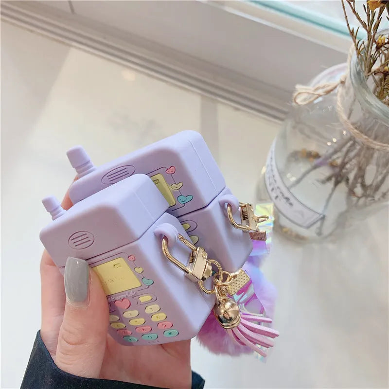 Purple silicone protective case for Apple AirPods with detachable fur ball pendant accessory