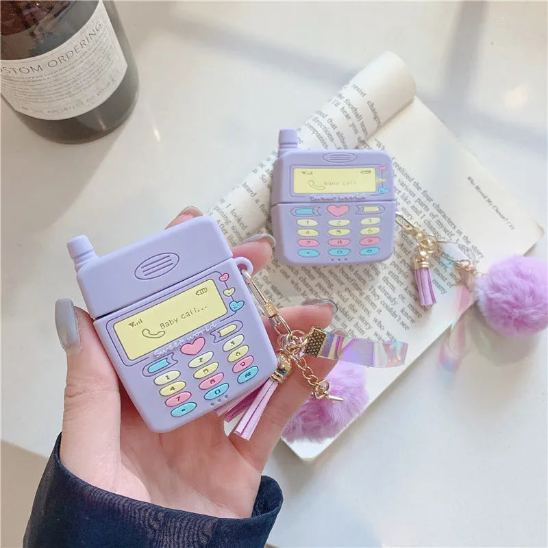Purple silicone protective case for Apple AirPods with detachable fur ball pendant accessory