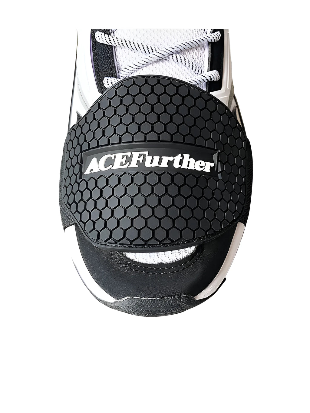 Black rubber motorcycle shift pad with anti-slip silicone and adjustable hook and loop fastening on a boot.