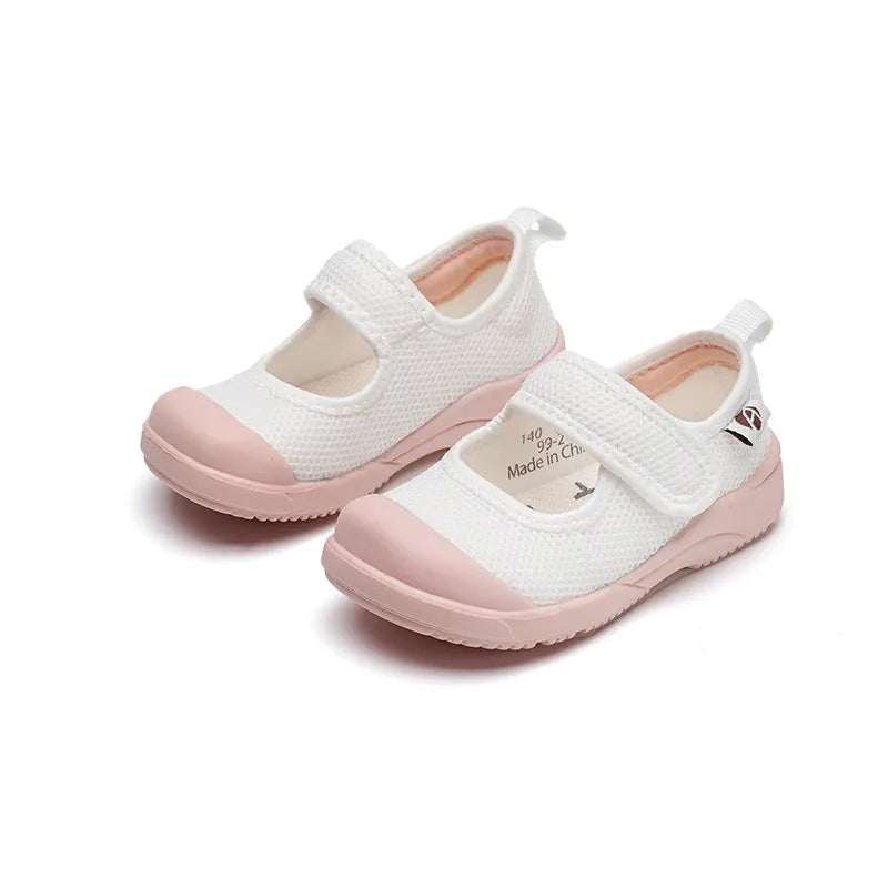 White and pink children's cloth shoes with mesh uppers and Velcro fastening