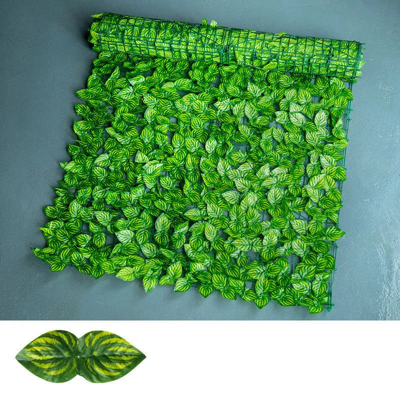 Green artificial radish leaf fence panel showing detailed plastic foliage for balcony and garden screening
