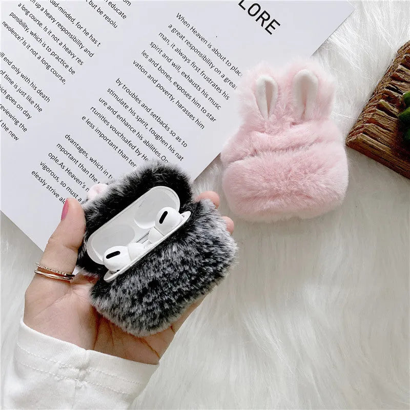 Pink silicone protective cover with rabbit ears for Apple AirPods charging case.
