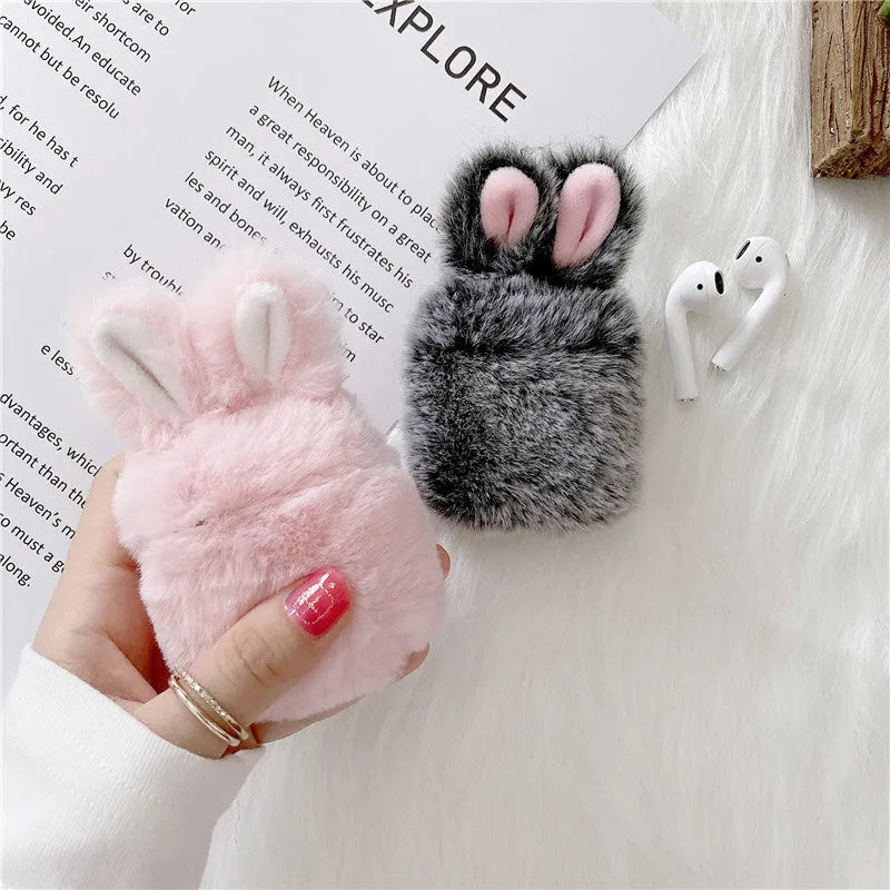 Pink silicone protective cover with rabbit ears for Apple AirPods charging case.