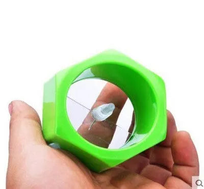 Yellow spiral vegetable cutter with 8cm diameter creating cucumber spirals in kitchen