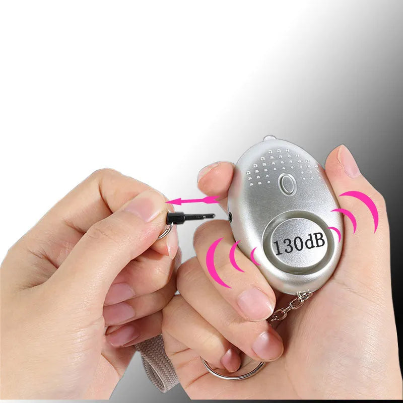 Personal security alarm with LED light in multiple colour options including black, pink and silver