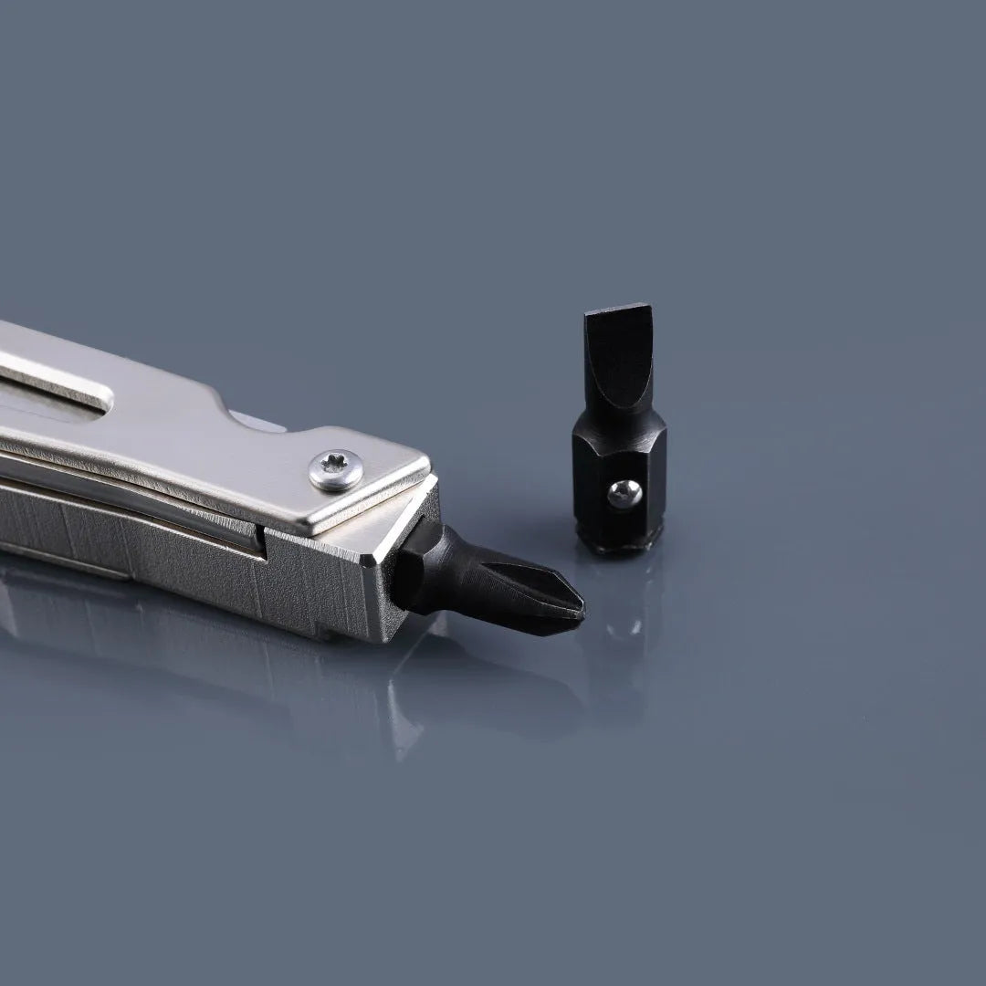 White stainless steel multi-function tool showing wrench, knife blade, and needle nose pliers design