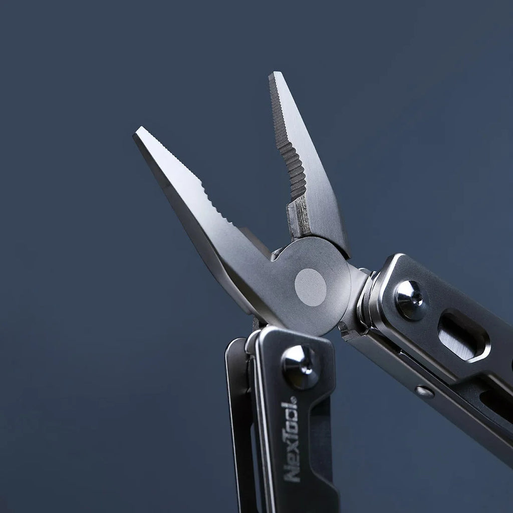 White stainless steel multi-function tool showing wrench, knife blade, and needle nose pliers design