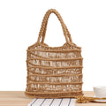 Women's woven straw beach bag with square shape and double handles in natural texture