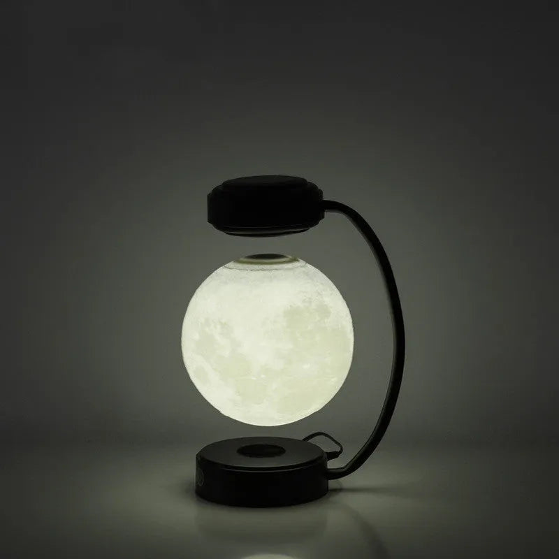 Magnetic levitation moon lamp with colour-changing light floating above base