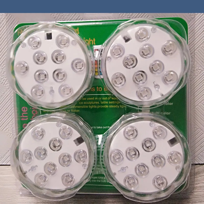 Round white remote control waterproof LED light with colour-changing LEDs for garden and pool decoration.