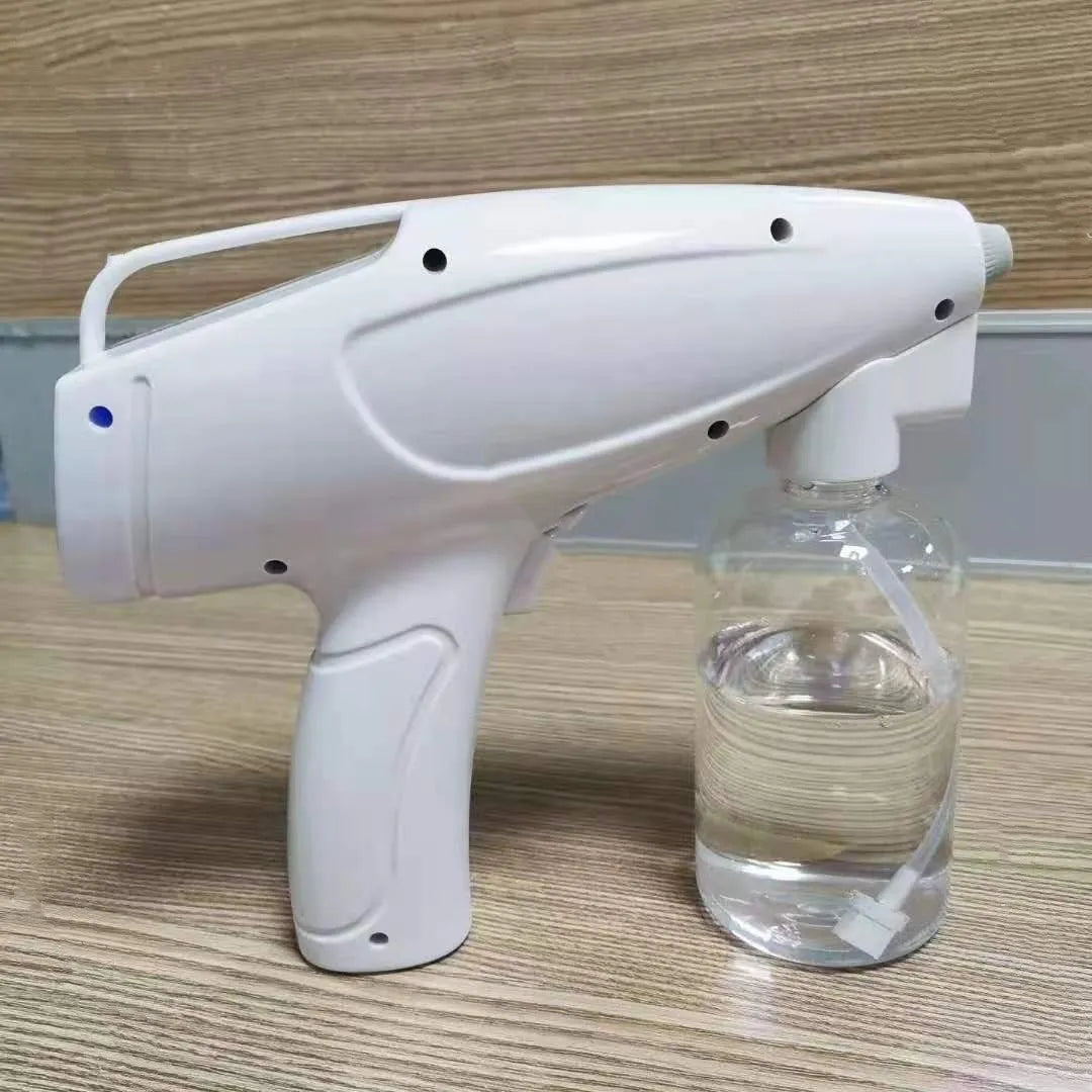 White handheld cordless spray disinfection gun with USB Type-C charging port and anti-blocking nozzle