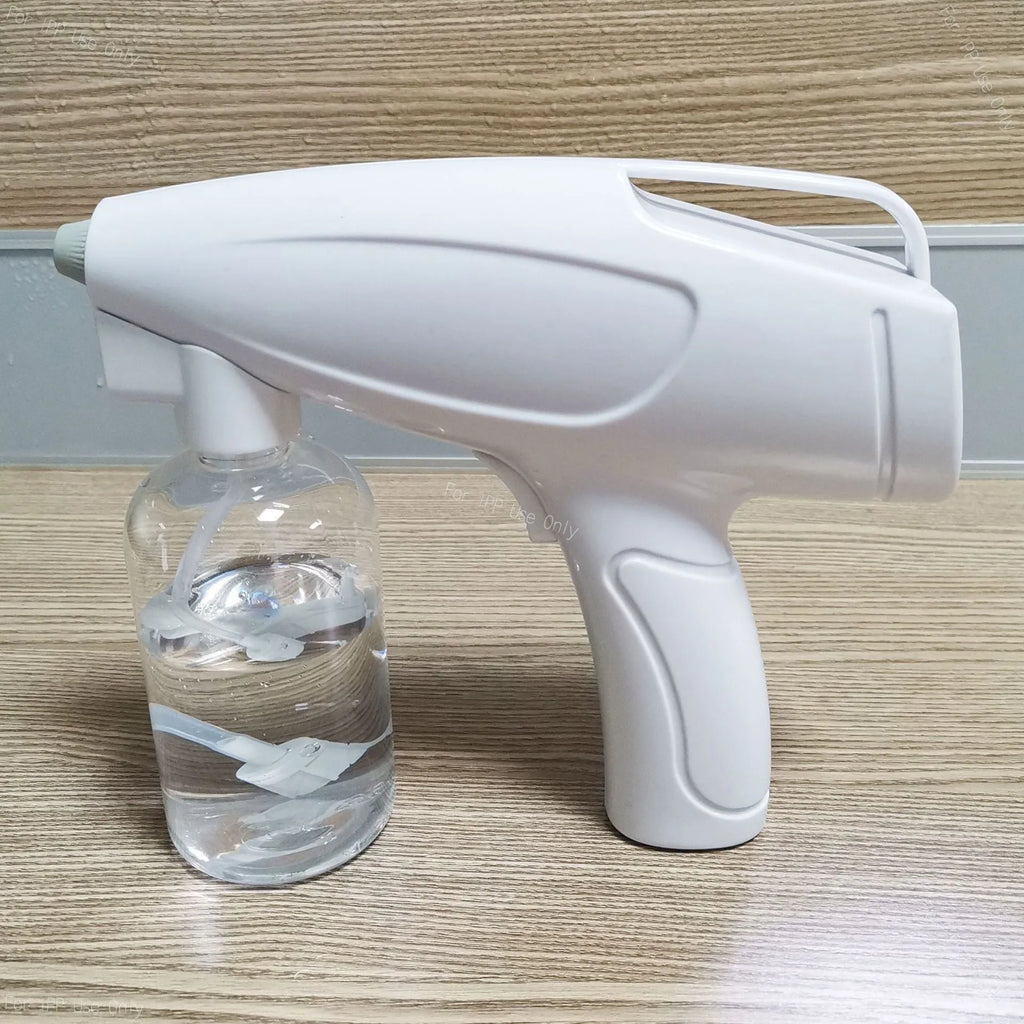 White handheld cordless spray disinfection gun with USB Type-C charging port and anti-blocking nozzle