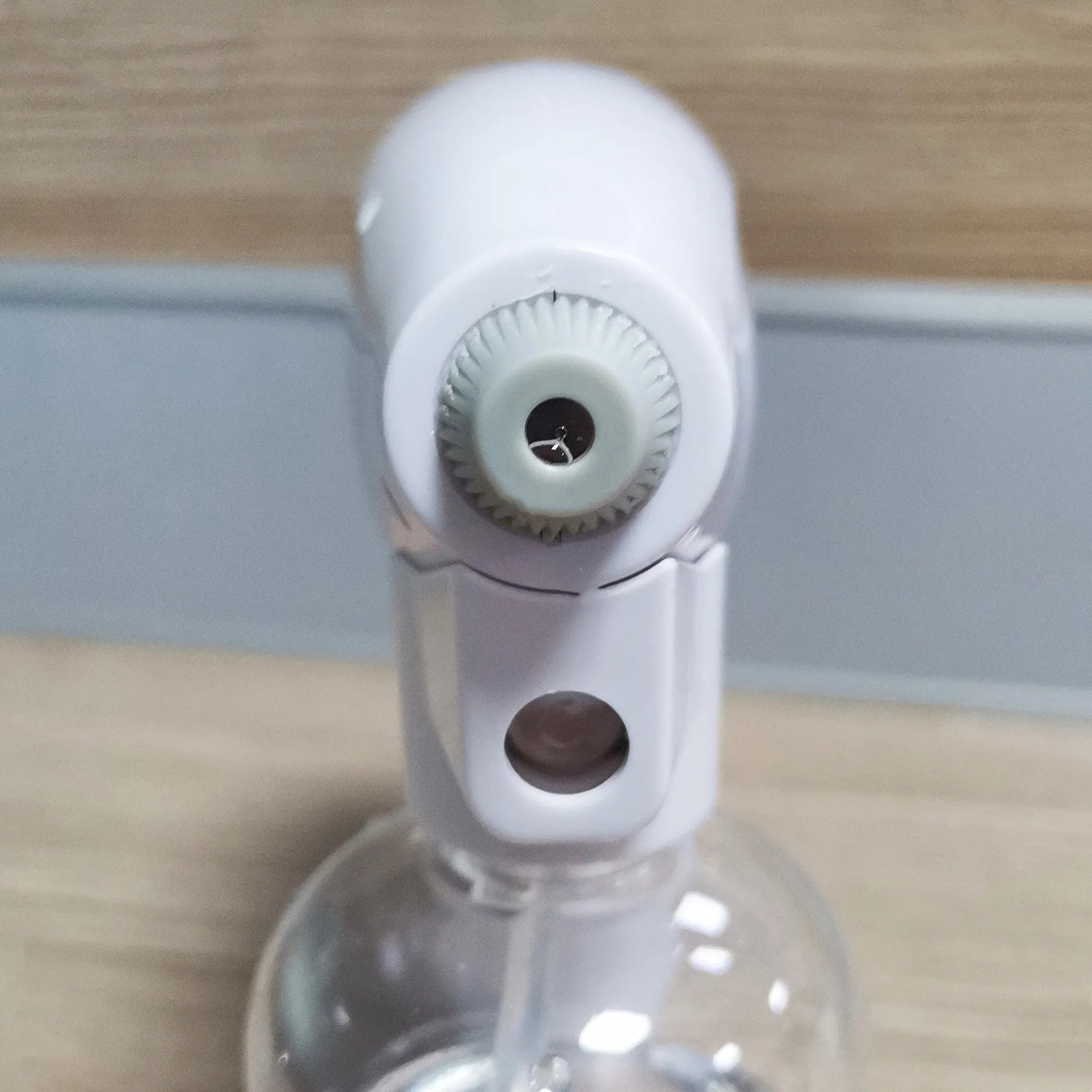 White handheld cordless spray disinfection gun with USB Type-C charging port and anti-blocking nozzle