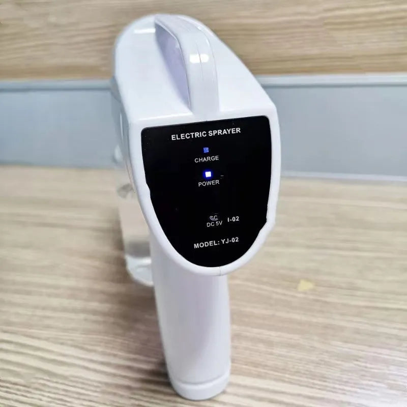 White handheld cordless spray disinfection gun with USB Type-C charging port and anti-blocking nozzle