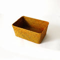 Natural straw desk storage organiser box for pens and cosmetics, shown in brown colour.
