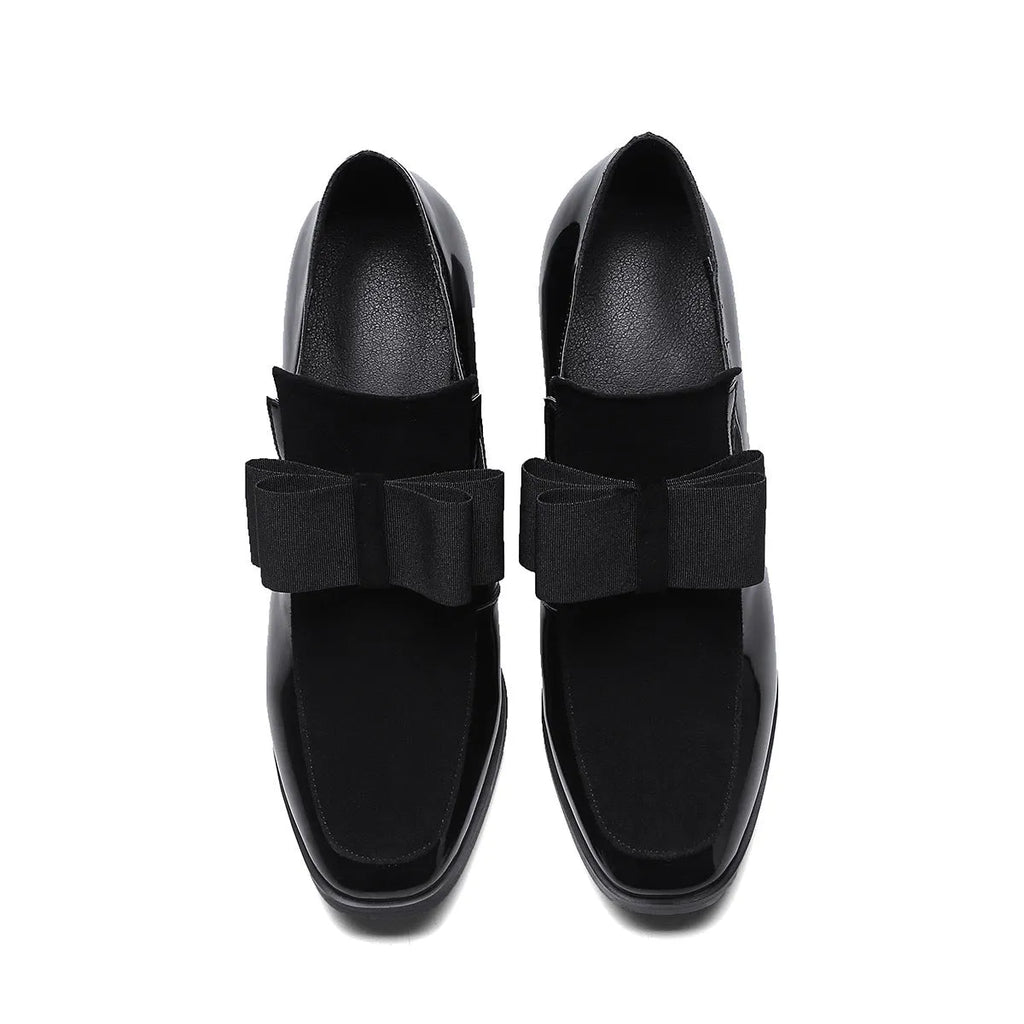 Women's black patent leather high heels with 8cm thick heel and square toe design on wooden floor