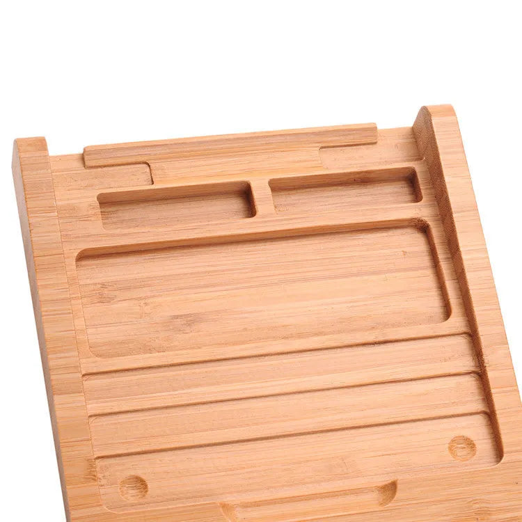 Bamboo wood Apple Bluetooth tablet bracket on a desk next to a trackpad.