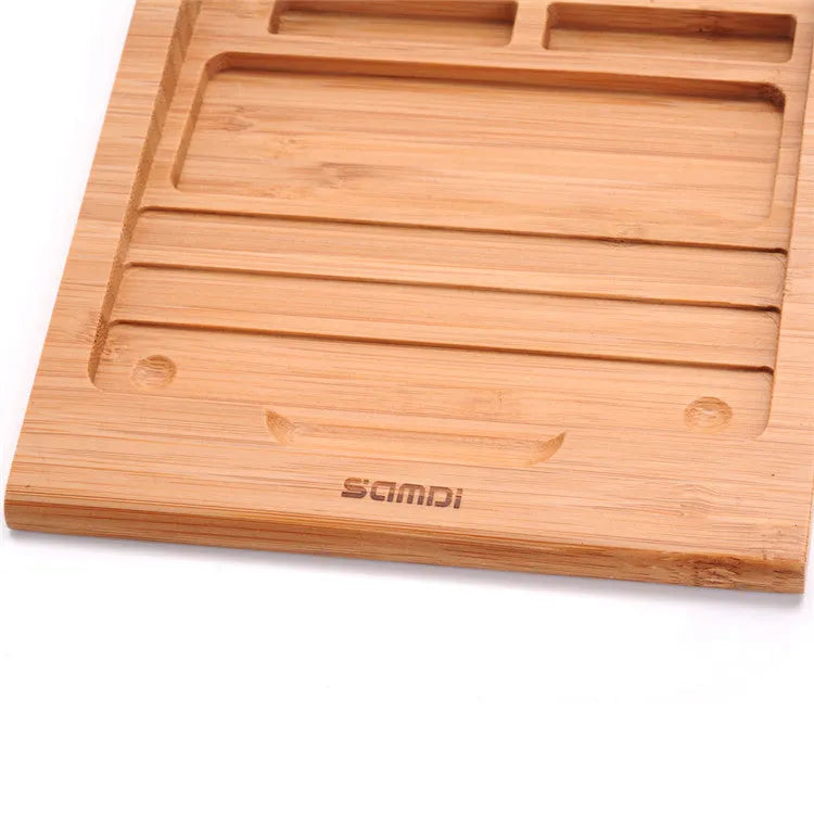 Bamboo wood Apple Bluetooth tablet bracket on a desk next to a trackpad.