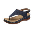 Women's casual wedge heel flip flop sandals with an adjustable buckle strap on the back, shown in a solid colour.