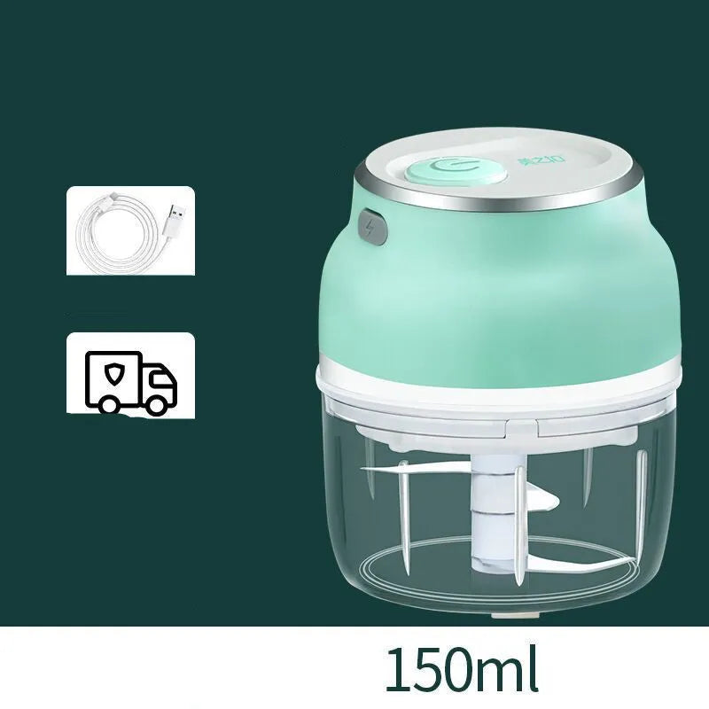 Portable electric mini food chopper with transparent cup and stainless steel blade on a kitchen counter