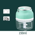 Portable electric mini food chopper with transparent cup and stainless steel blade on a kitchen counter