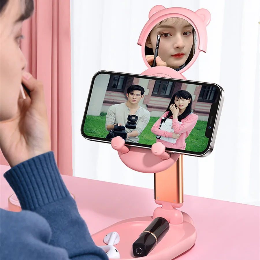 Blue foldable phone holder with mirror for Apple iPhone and iPad on a desk
