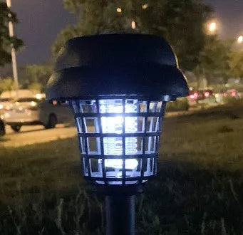 White and purple solar-powered mosquito killer lamp for outdoor garden and patio use.