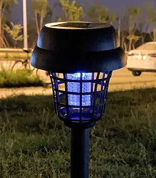 White and purple solar-powered mosquito killer lamp for outdoor garden and patio use.