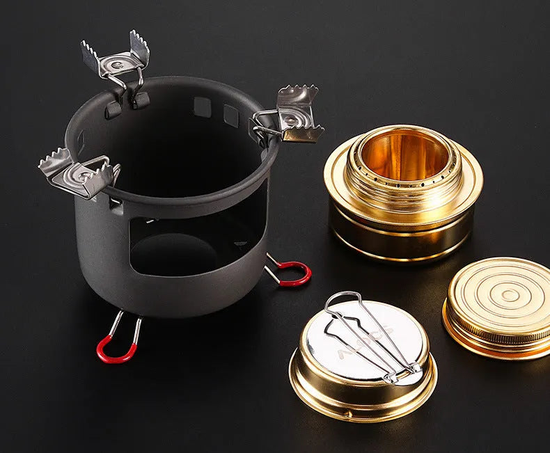 Alocs one-piece alcohol stove for outdoor use, shown with optional 0.8L or 1.4L kettle set and handle options