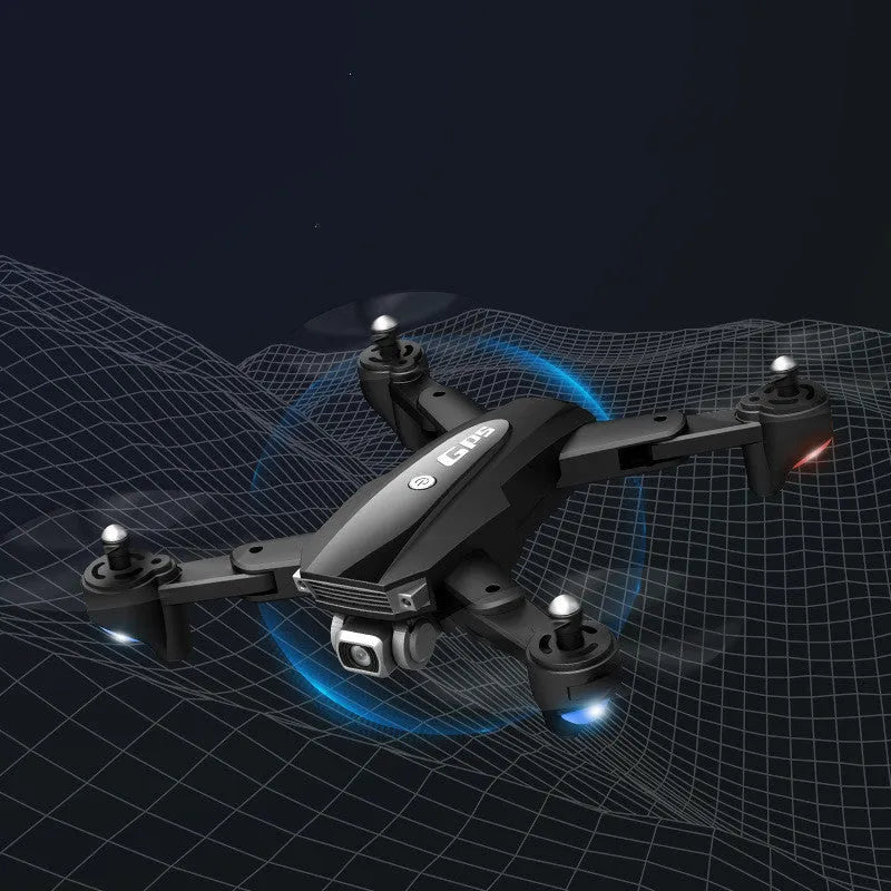 Black and red folding 4K quadcopter drone for children with remote control on grass