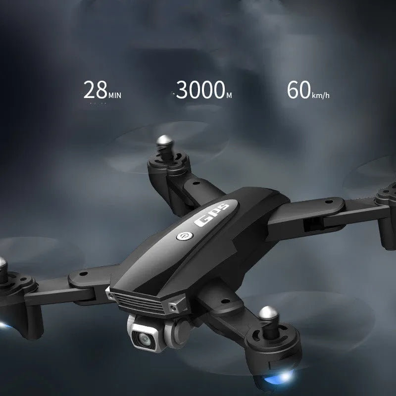 Black and red folding 4K quadcopter drone for children with remote control on grass