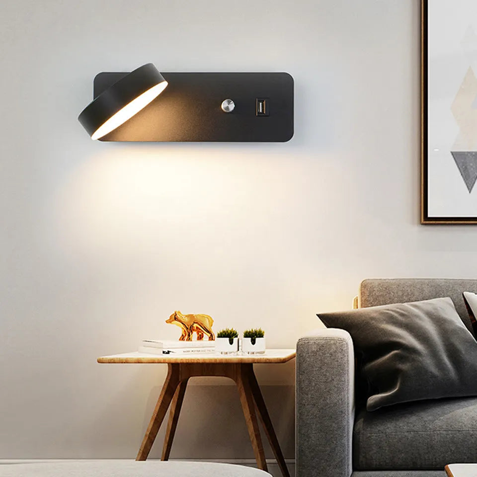 Square modern LED wall lamp with rotating head on white wall