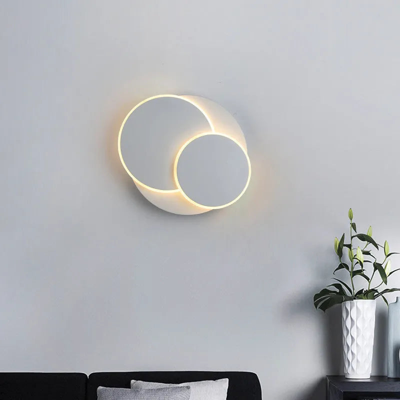 Round wall lamp with acrylic shade in black or white, available in 22cm, 18cm, and 14cm sizes for home lighting