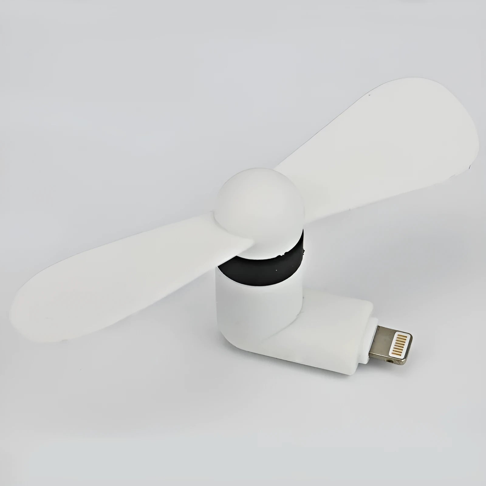 White portable mini fan with plastic blades and a rotary switch for mobile phones.