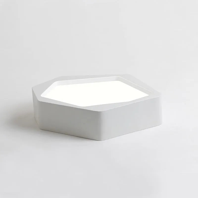 Geometric shaped LED light in black or white, measuring 380x260x80mm, with remote control for dimming