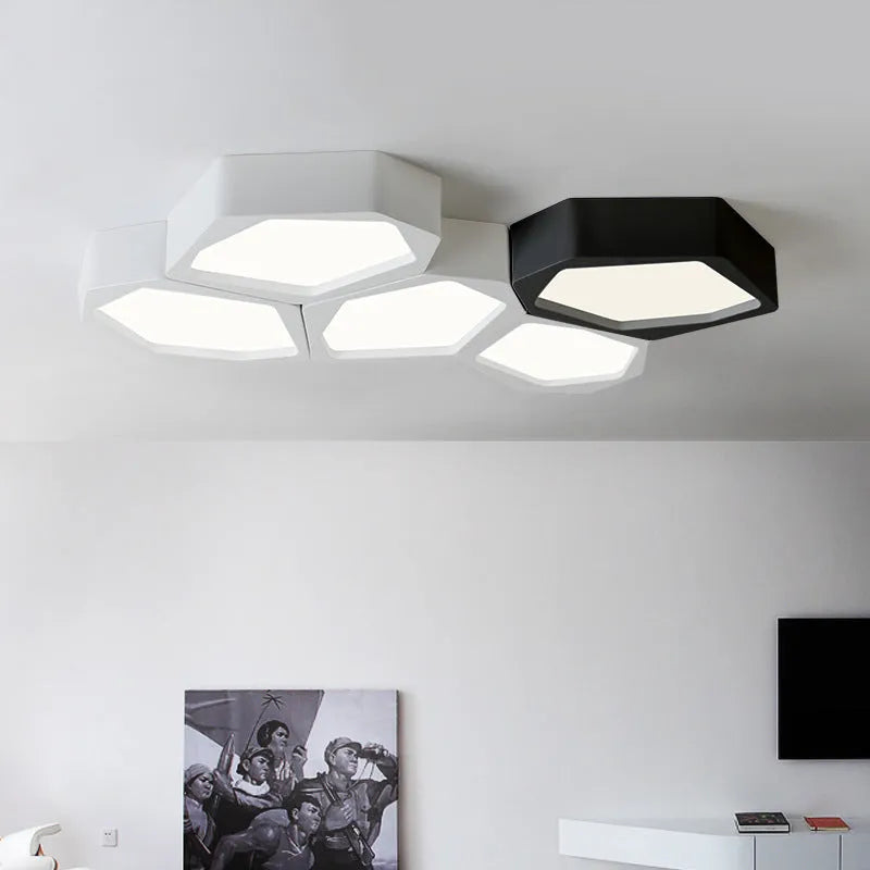 Geometric shaped LED light in black or white, measuring 380x260x80mm, with remote control for dimming