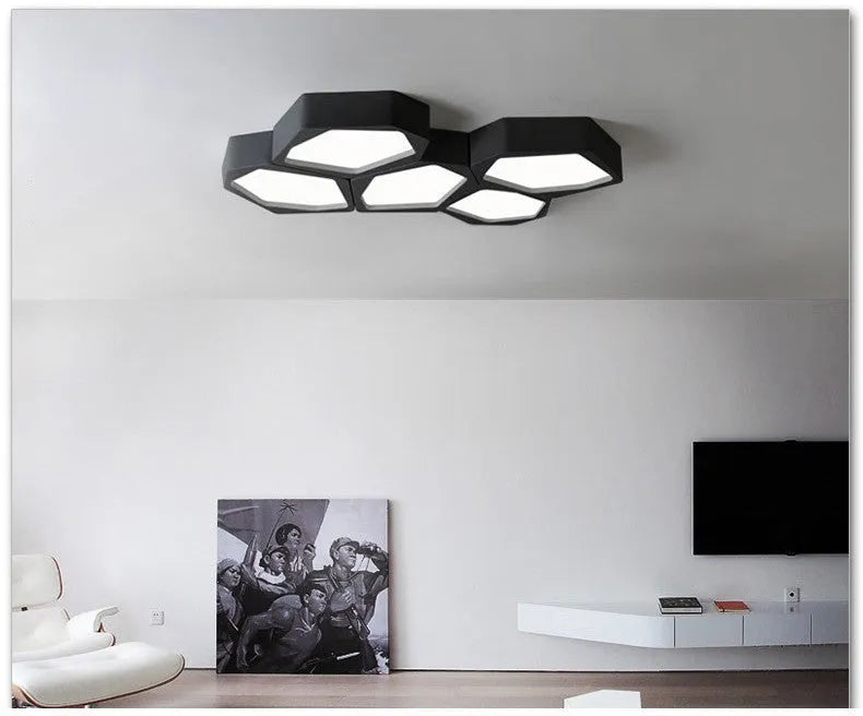 Geometric shaped LED light in black or white, measuring 380x260x80mm, with remote control for dimming