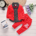 Toddler boy wearing a grey casual printed jacket and matching trousers suit set