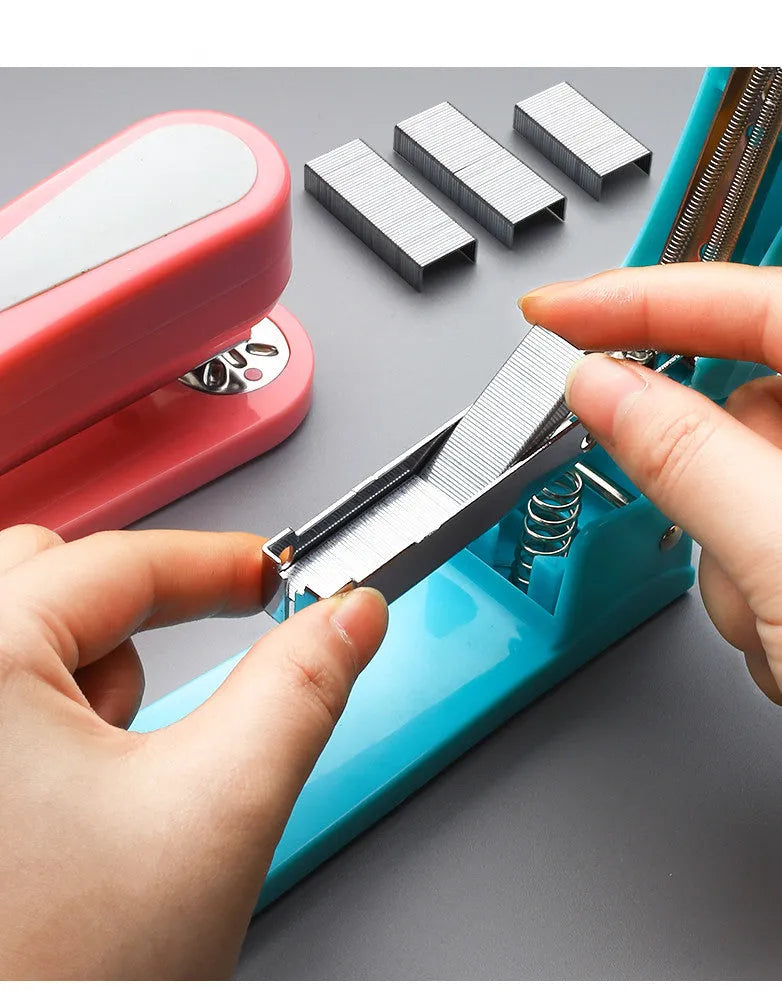 Rotatable stapler in black showing 360-degree head rotation and metal nail outlet for binding documents