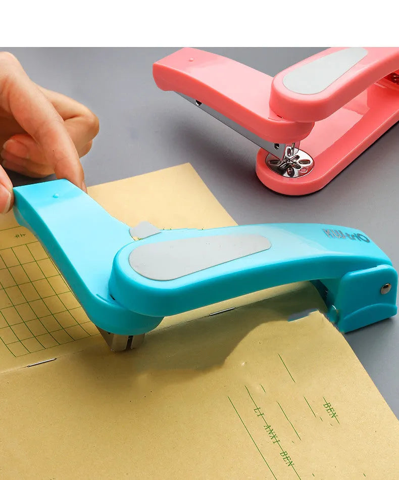 Rotatable stapler in black showing 360-degree head rotation and metal nail outlet for binding documents