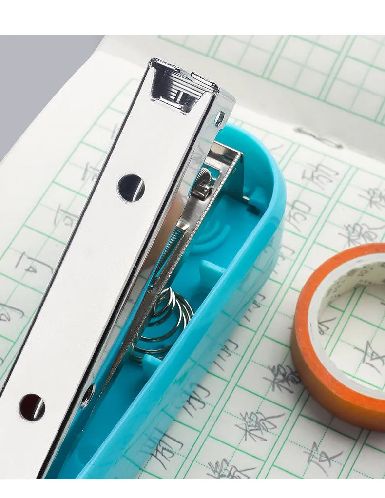 Rotatable stapler in black showing 360-degree head rotation and metal nail outlet for binding documents