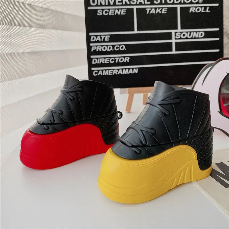Silicone flip AirPods protective cover in black and red-shoes or black and yellow-shoes colour