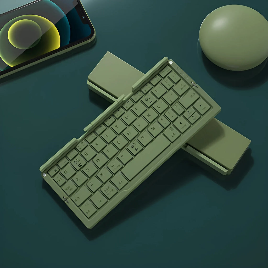 Silver white folding Bluetooth keyboard shown open with stand holding a smartphone, and folded next to a ruler for scale.